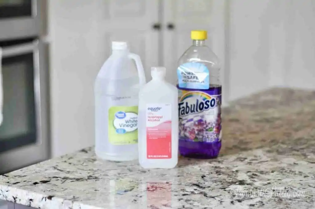 bottles of fabuloso, vinegar, and rubbing alcohol.
