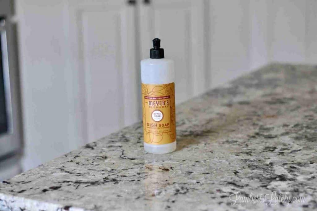 mrs. meyer's dish soap bottle on a kitchen counter.