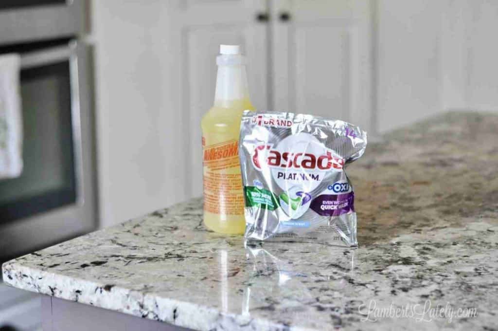 totally awesome cleaner and a pack of cascade dish tabs on a counter.