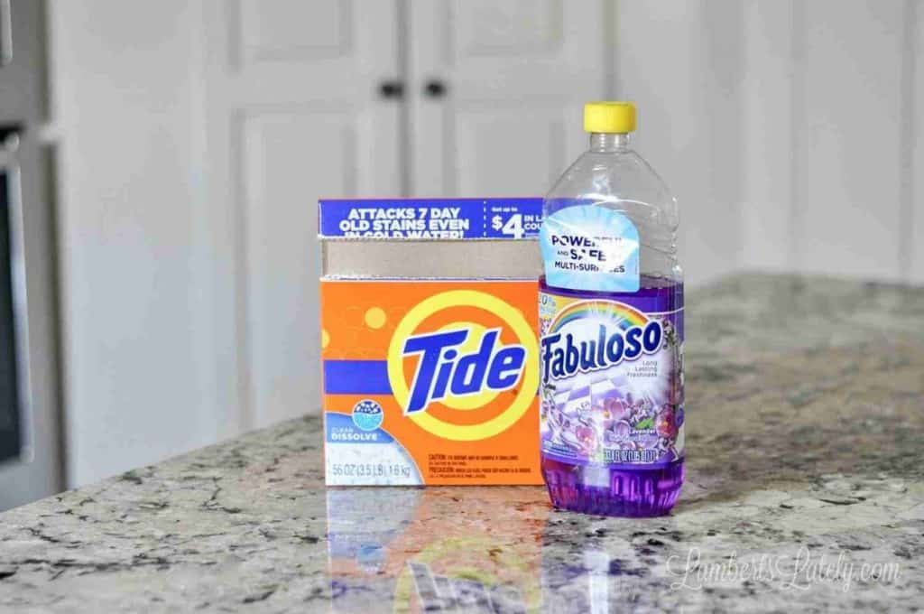 box of tide powder and fabuloso on a countertop.