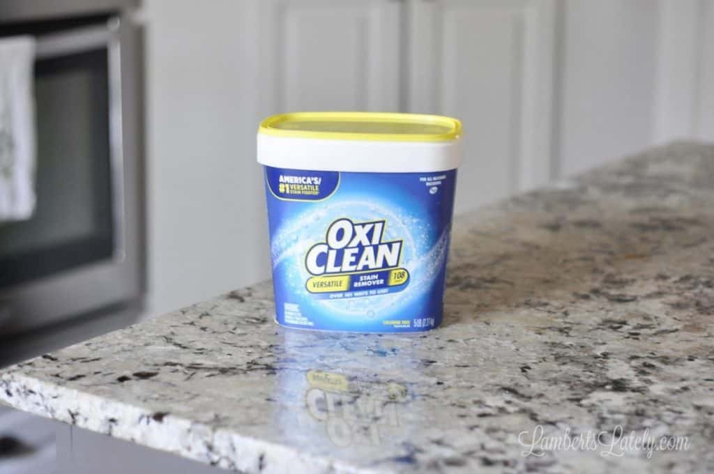 tub of oxi clean on a counter.