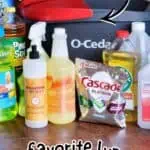 Collection of mopping solutions and cleaning supplies with a red mop head in the background.