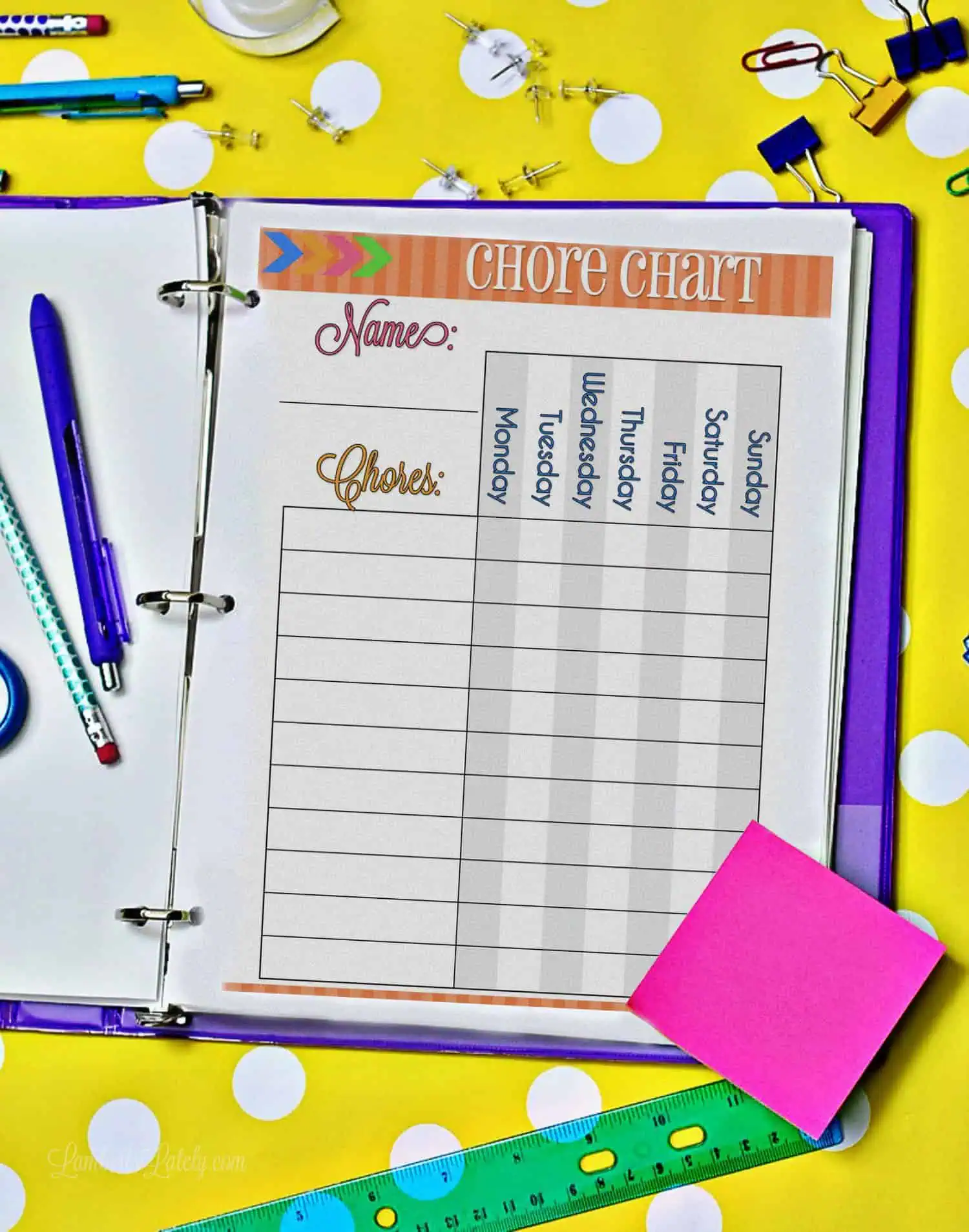 chore chart printable in a notebook on a desk.