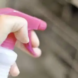 spraying a pink spray nozzle.