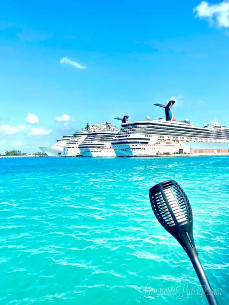 cruise ships lined up in bright blue water.