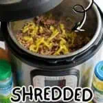 Shredded Mississippi Pot Roast in Instant Pot with yellow peppers and seasonings.