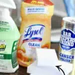 Assorted household cleaning products including Lysol, Bar Keepers Friend, and others on a wooden表.