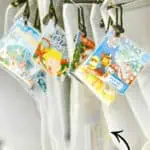 Board game storage ideas using clear zippered file bags for organization.