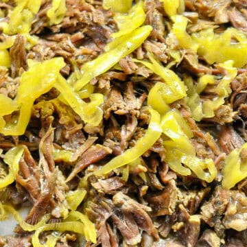 mississippi pot roast, shredded, covered in pepperoncini peppers.