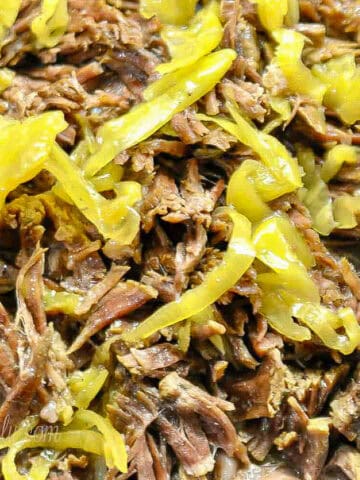 mississippi pot roast, shredded, covered in pepperoncini peppers.
