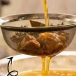 Homemade chicken stock being strained from an Instant Pot recipe for bone broth.