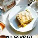Pumpkin Tres Leches Cake made with box cake mix on a white plate with autumn decorations.