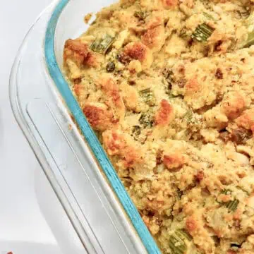 Jiffy Cornbread Dressing with Sausage in a glass baking dish.
