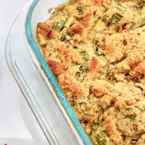 Jiffy Cornbread Dressing with Sausage in a glass baking dish.