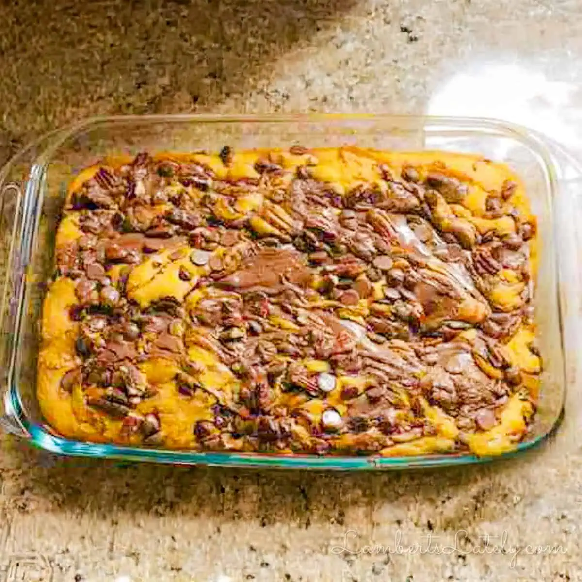 a baked pumpkin earthquake cake in a pan, with swirls of nutella.