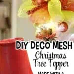 Colorful DIY Christmas tree topper made with mesh, ribbons, and ornaments.