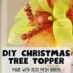 Colorful DIY Christmas tree topper with mesh ribbon and decorative accents.