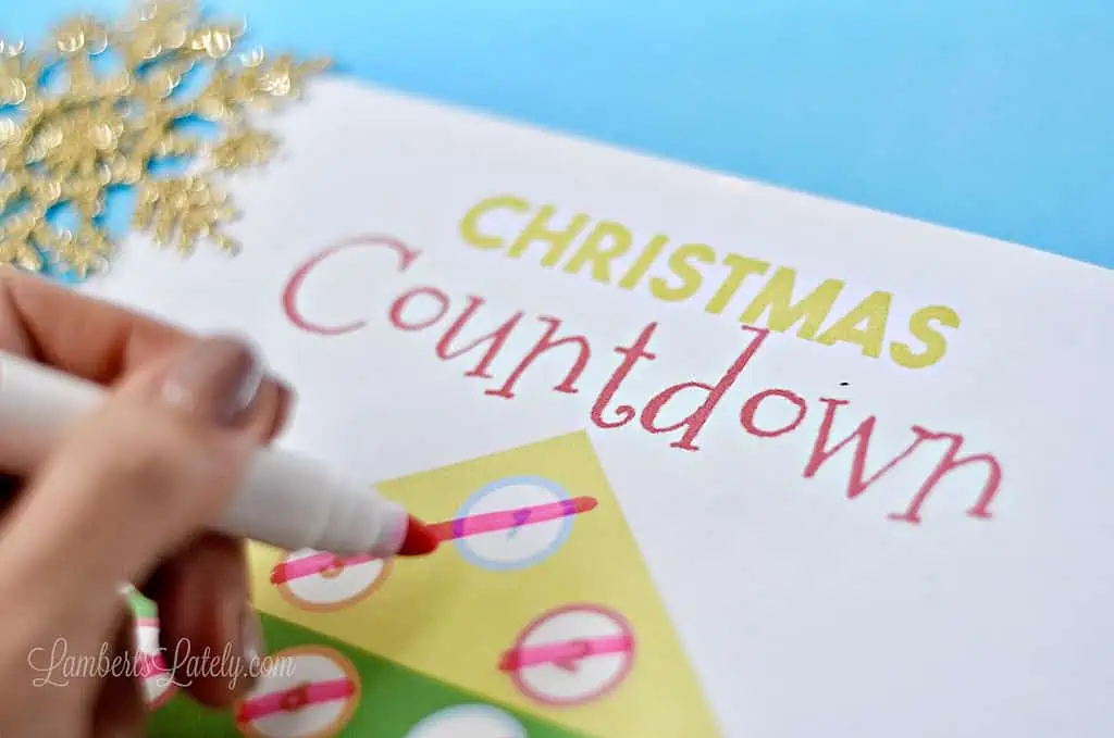 drawing on a countdown printable with a marker.