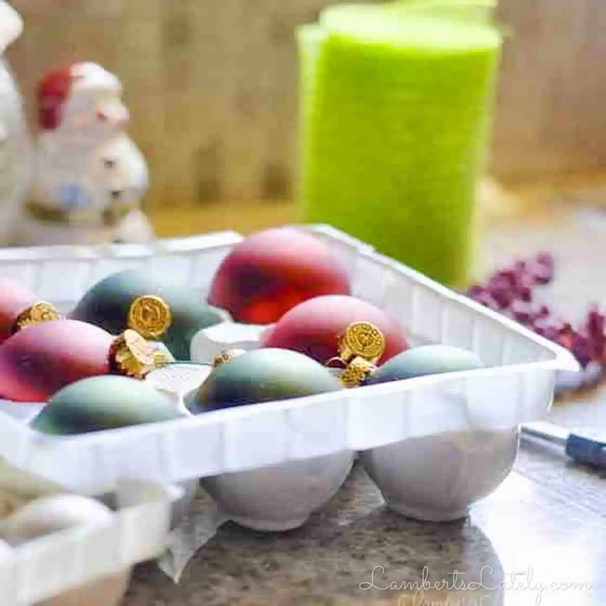 Christmas ornaments and floral picks used to decorate DIY tree topper.