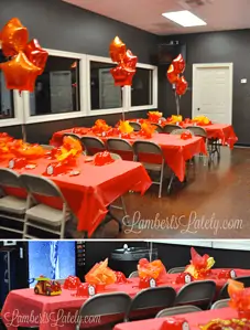 party room with red table cloths and fire truck decorations.