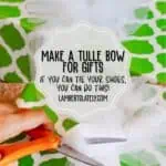 Step-by-step guide to making a tulle bow for gift wrapping with scissors and fabric.