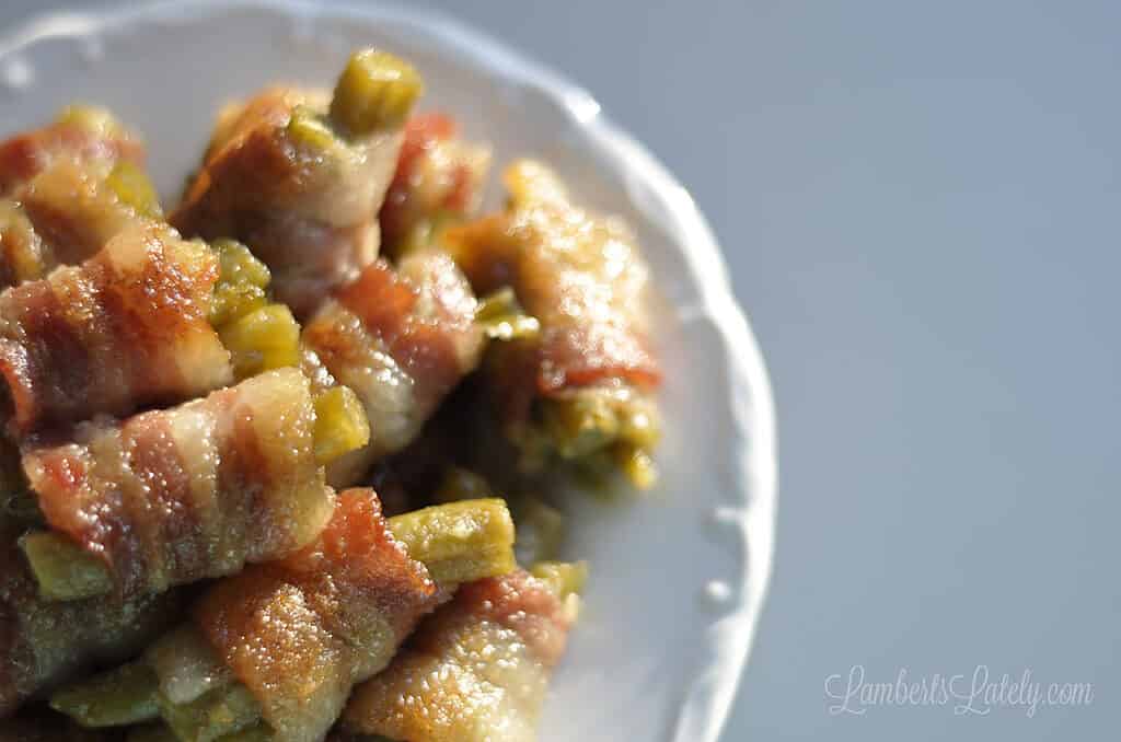 looking down on bacon green bean bundles on a plate