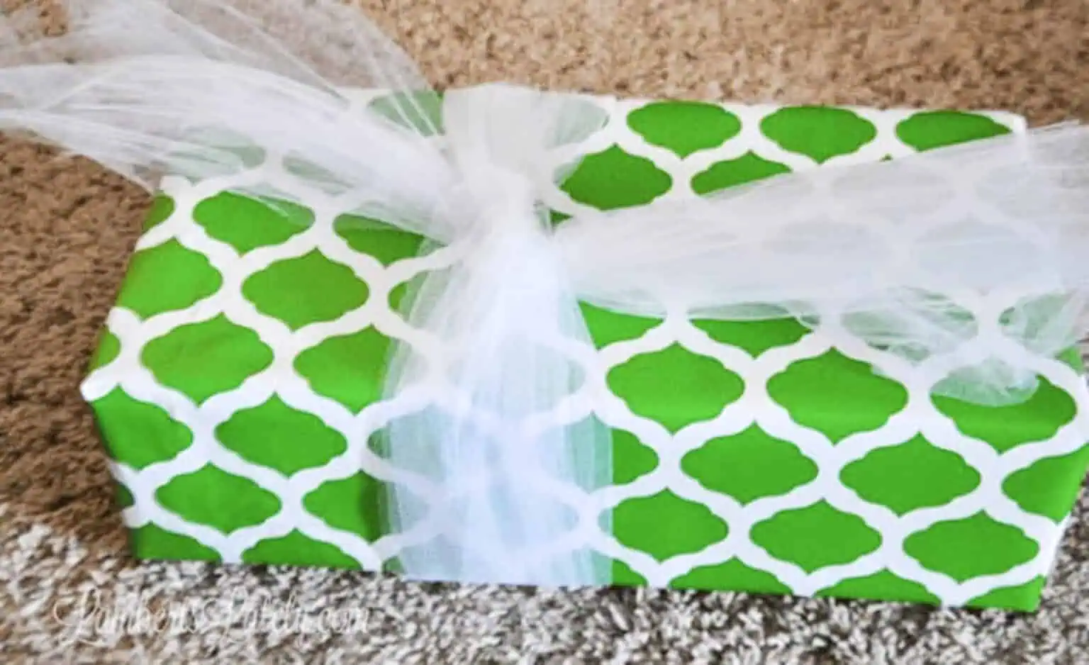 4-5 pieces of tulle loosely tied around a gift.
