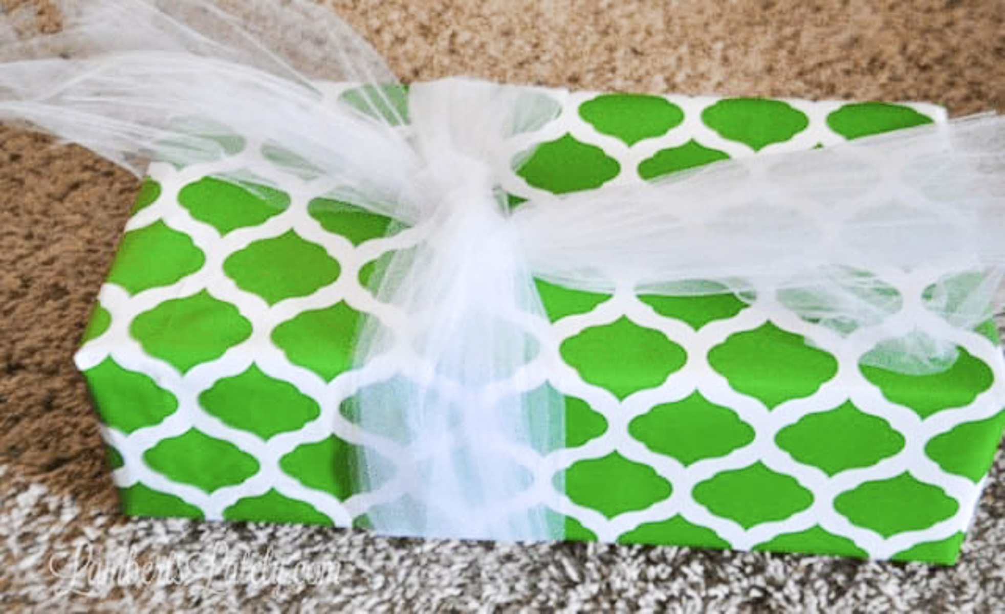 4-5 pieces of tulle loosely tied around a gift.