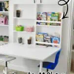 DIY Murphy bed with fold-up desk and IKEA bookcases in a modern home office.