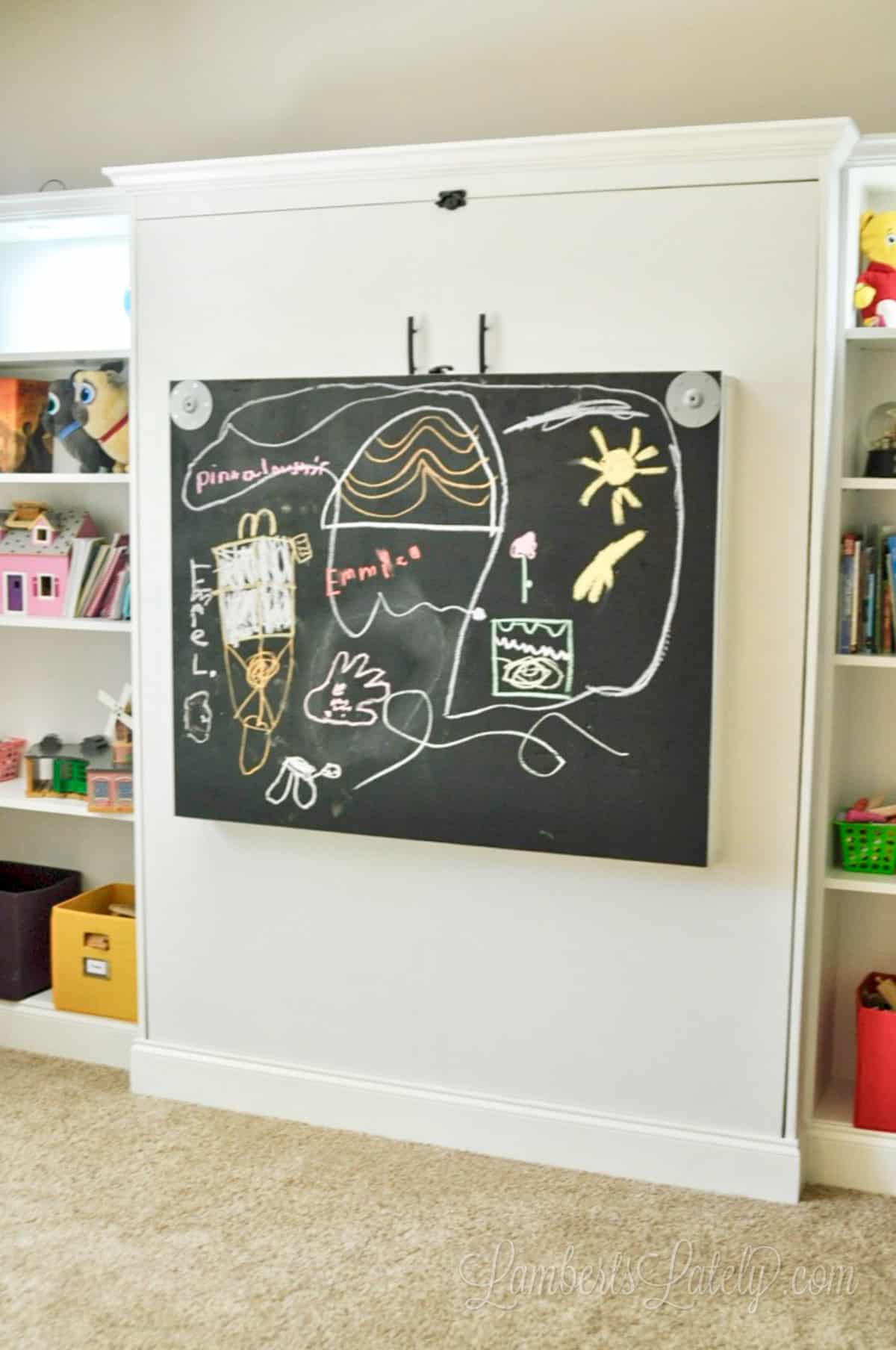 murphy bed desk closed with chalkboard showing.