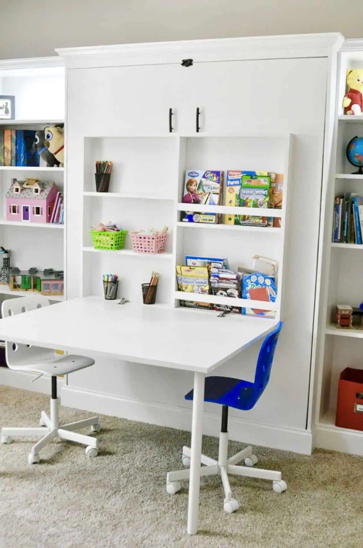 white diy murphy bed with Ikea billy bookcases and a fold-out desk.