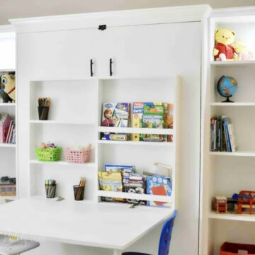Create-a-bed with Ikea billy bookcases and a fold-out desk.