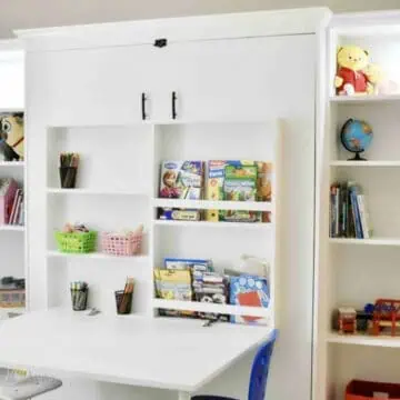 Create-a-bed with Ikea billy bookcases and a fold-out desk.