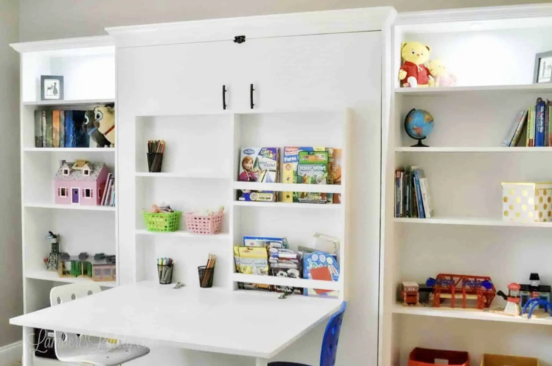 Create-a-bed with Ikea billy bookcases and a fold-out desk.