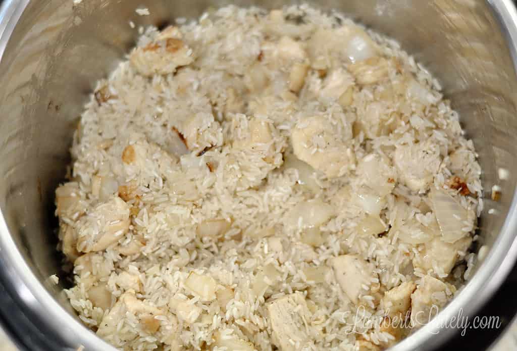 rice and chicken, with onion and garlic, in an instant pot.
