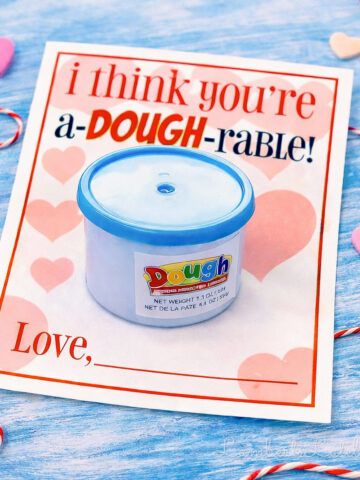 mini play doh cup attached to the play doh valentine printable card.