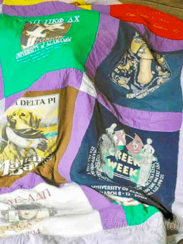 close up of t-shirt quilt draped on a table.