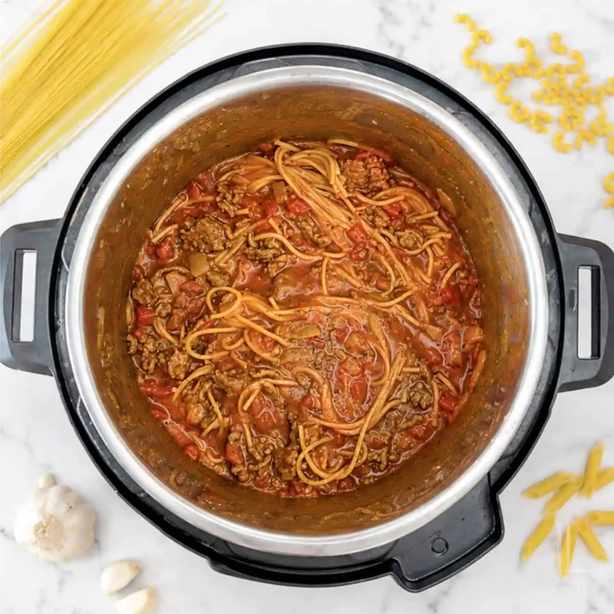 Cooked spaghetti with meat sauce in an Instant Pot for easy pasta meal.