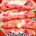 Stack of strawberry cheesecake cookies with pink and white layers, fresh strawberries nearby.