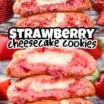 Close-up of strawberry cheesecake cookies with a creamy filling and pink cookie exterior.