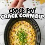 Close-up of a corn chip topped with colorful dip in a slow cooker for Crock Pot Corn Dip.