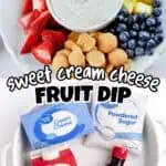 Sweet cream cheese fruit dip with strawberries, blueberries, pineapple, and graham crackers.