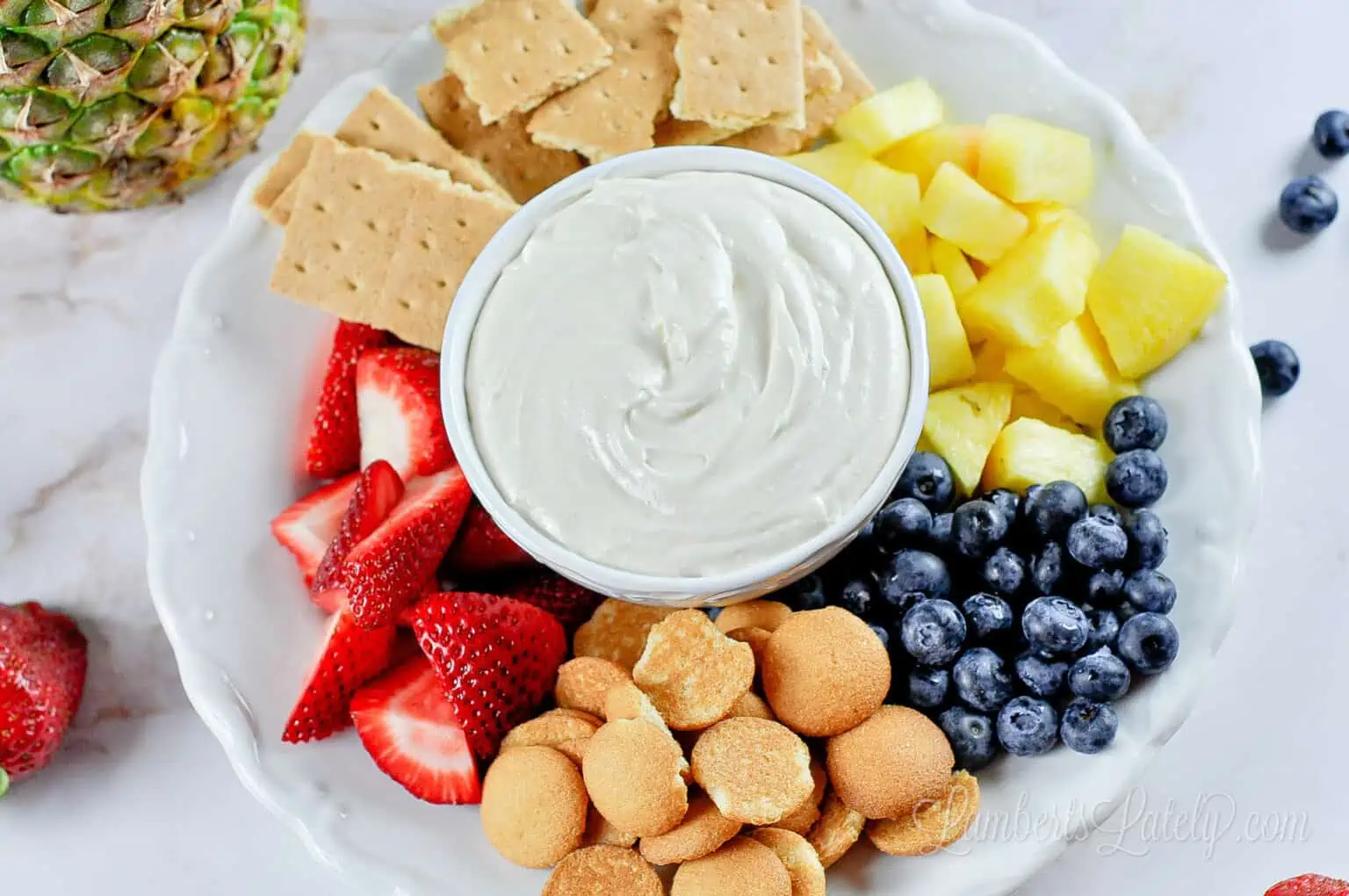 looking down on fruit dip and dippers.