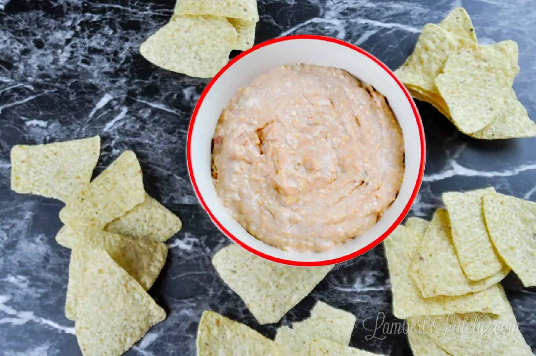 cream cheese and salsa dip with chips.