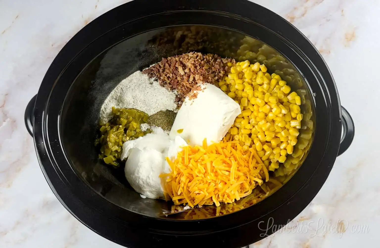 ingredients for corn dip in a crock pot.
