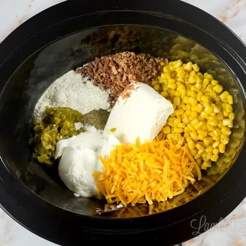 ingredients for corn dip in a crock pot.