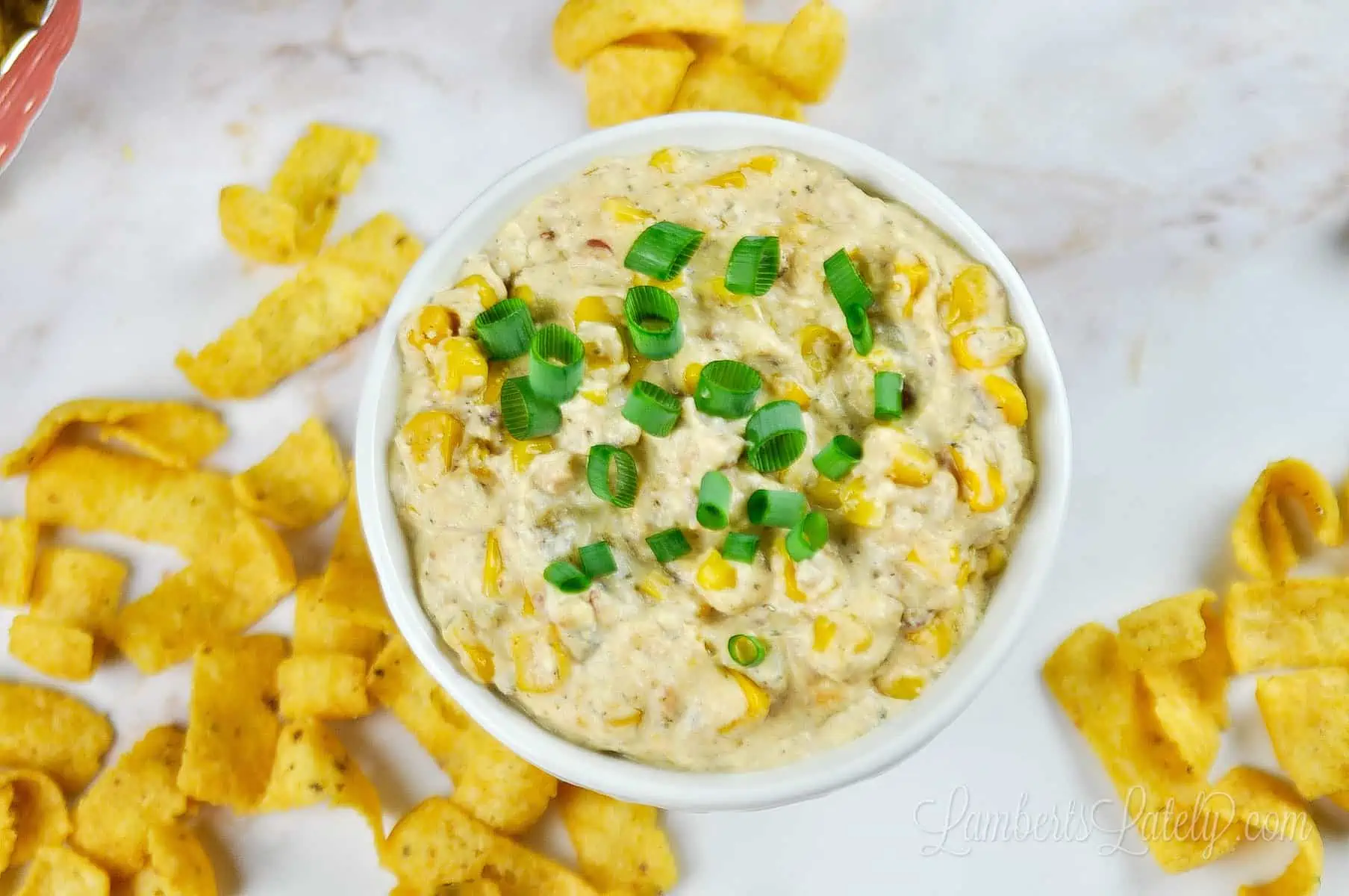 corn dip topped with green onions.