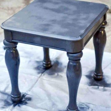 table covered in black spray paint.