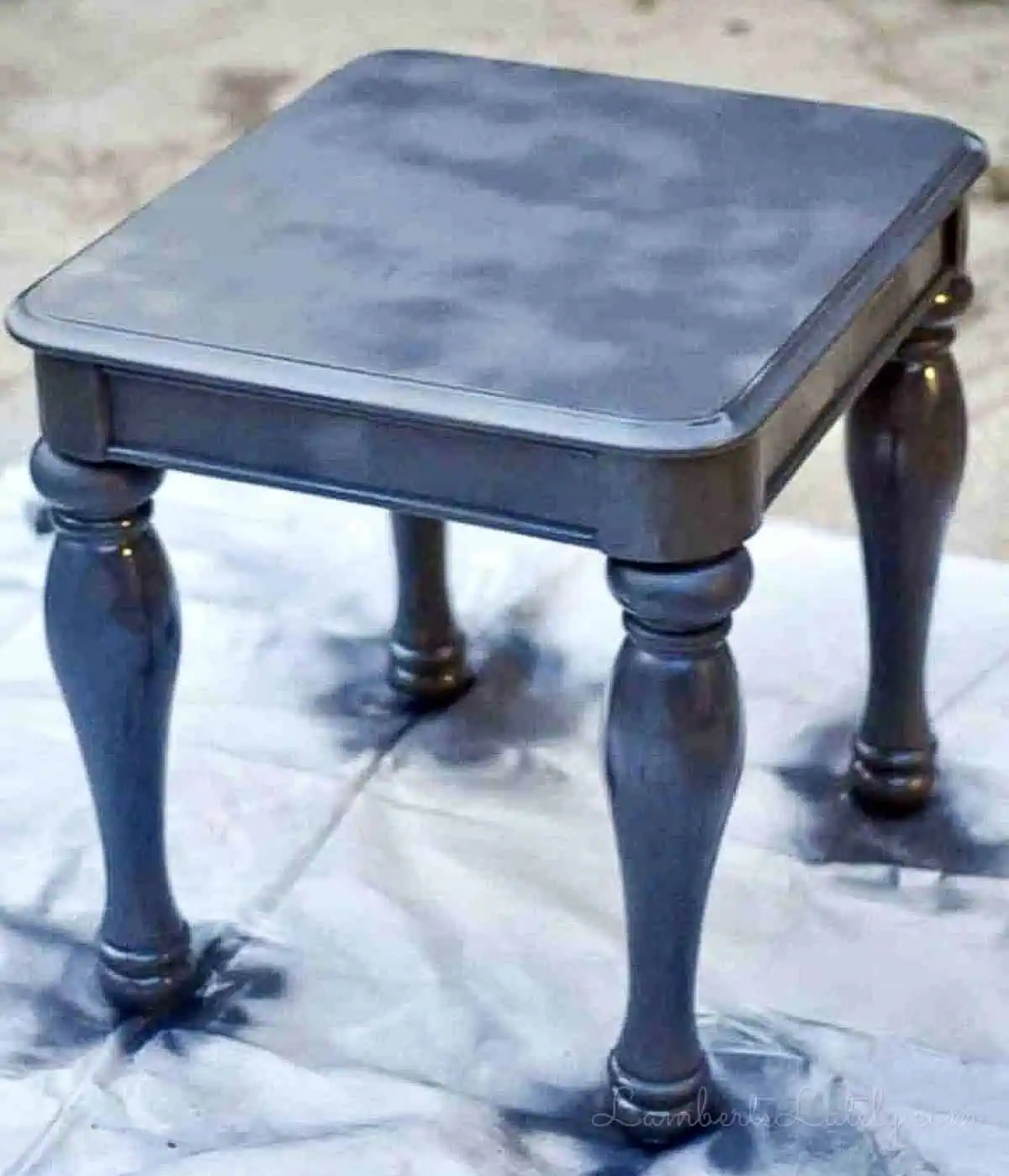 table covered in black spray paint.