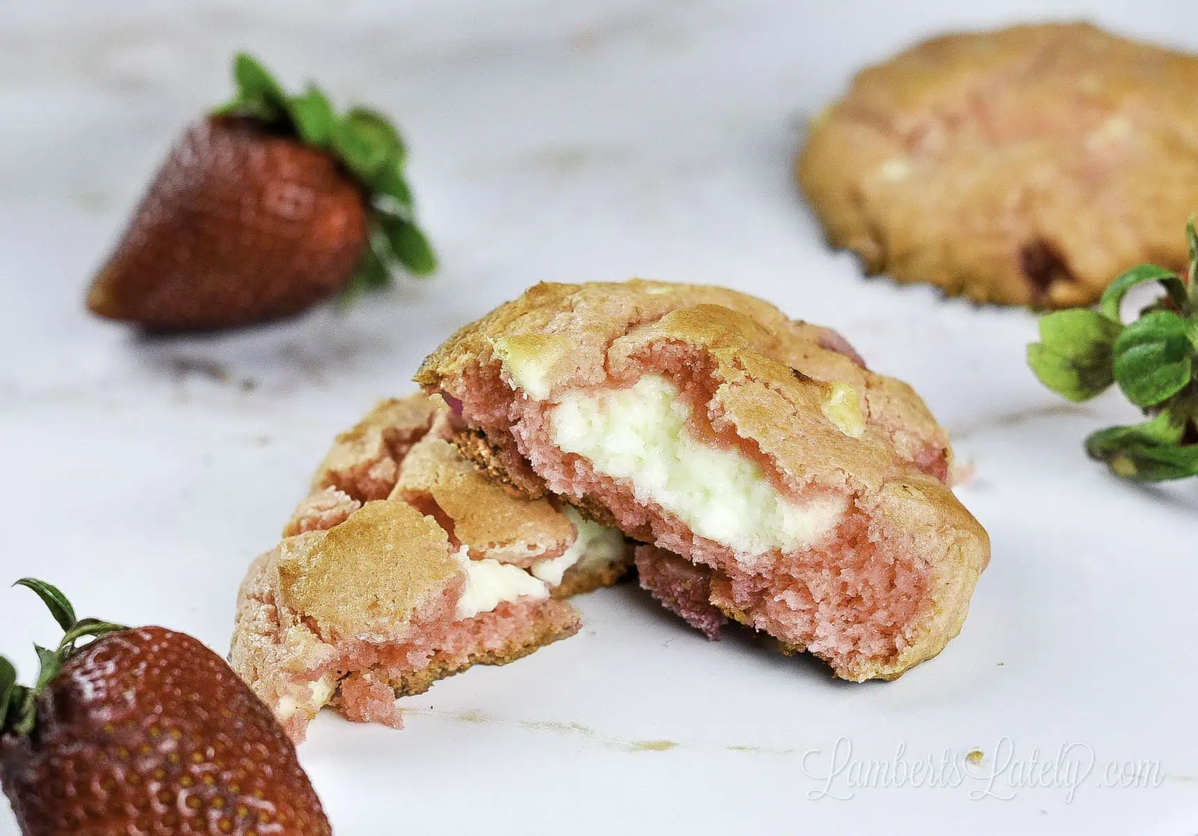 strawberry cheesecake cookie broken in half.